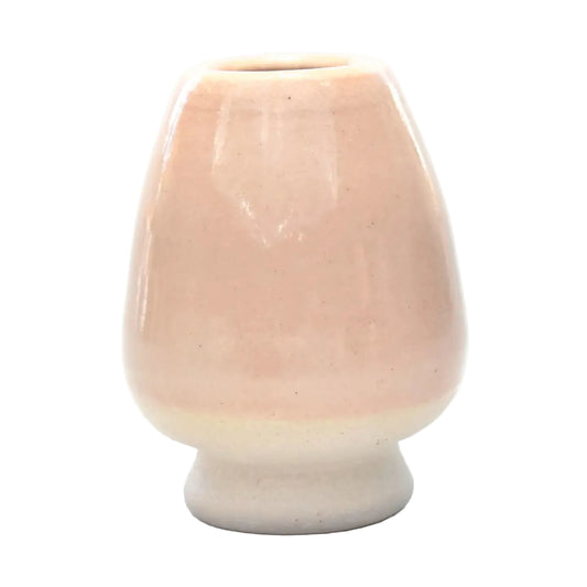 Ceramic vase with a gradient color from pink to white on a white background