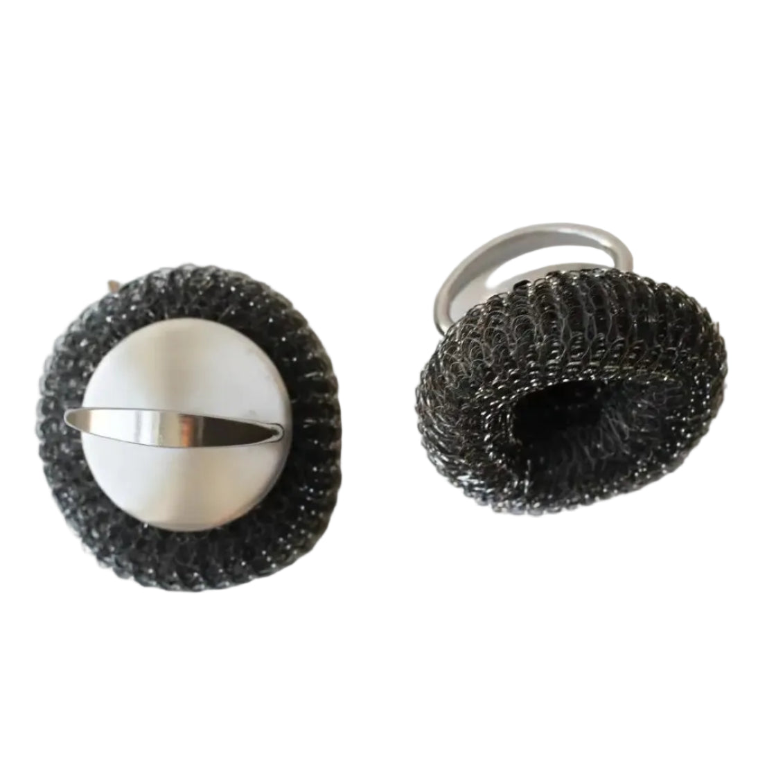 Two metal scrubbers with wire mesh on a white surface