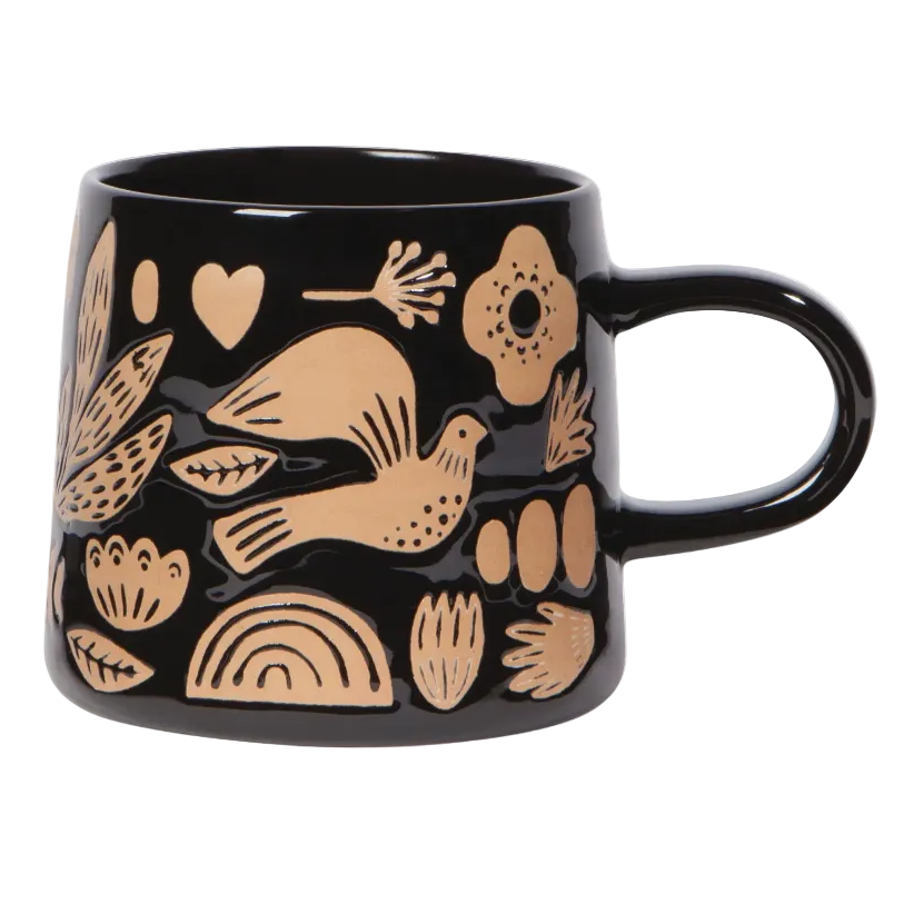 Black mug with brown patterns on a white background