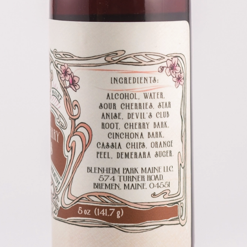 Bottle of sauce with a red cap on a white background
