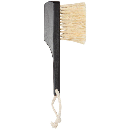 A Sisal Table Brush with a bamboo handle and sisal bristles, featuring a hanging loop.