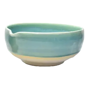 Ceramic bowl with a gradient blue and green color on a white background